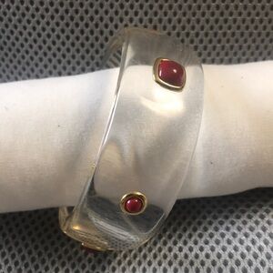 Clear bangle with red stones